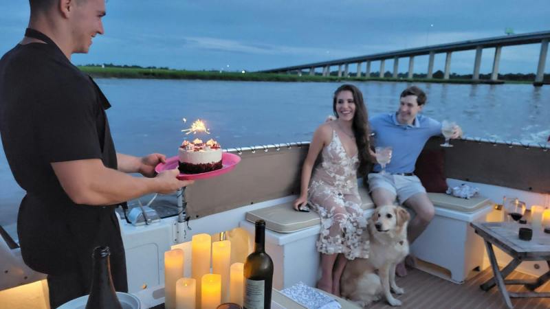 a group of people on a boat in the water