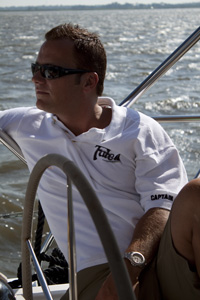 a person sitting on a boat in the water