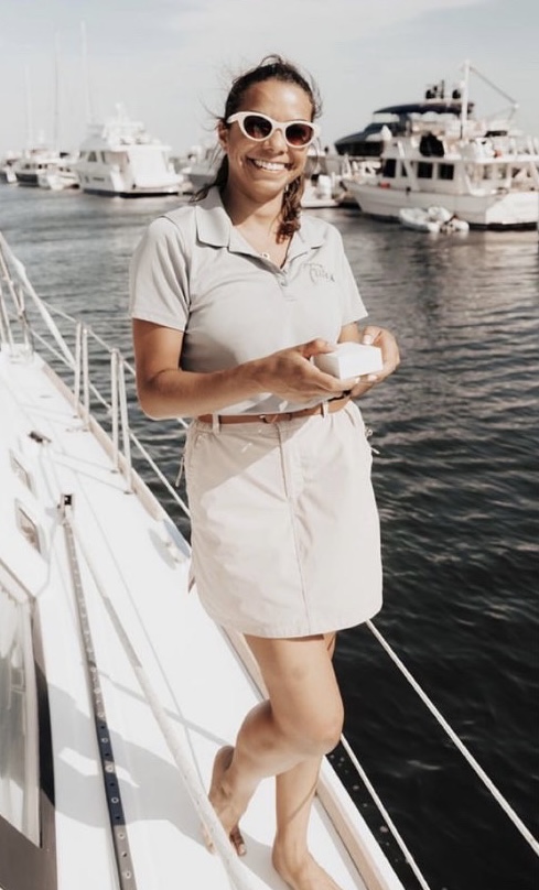 a person standing next to a body of water
