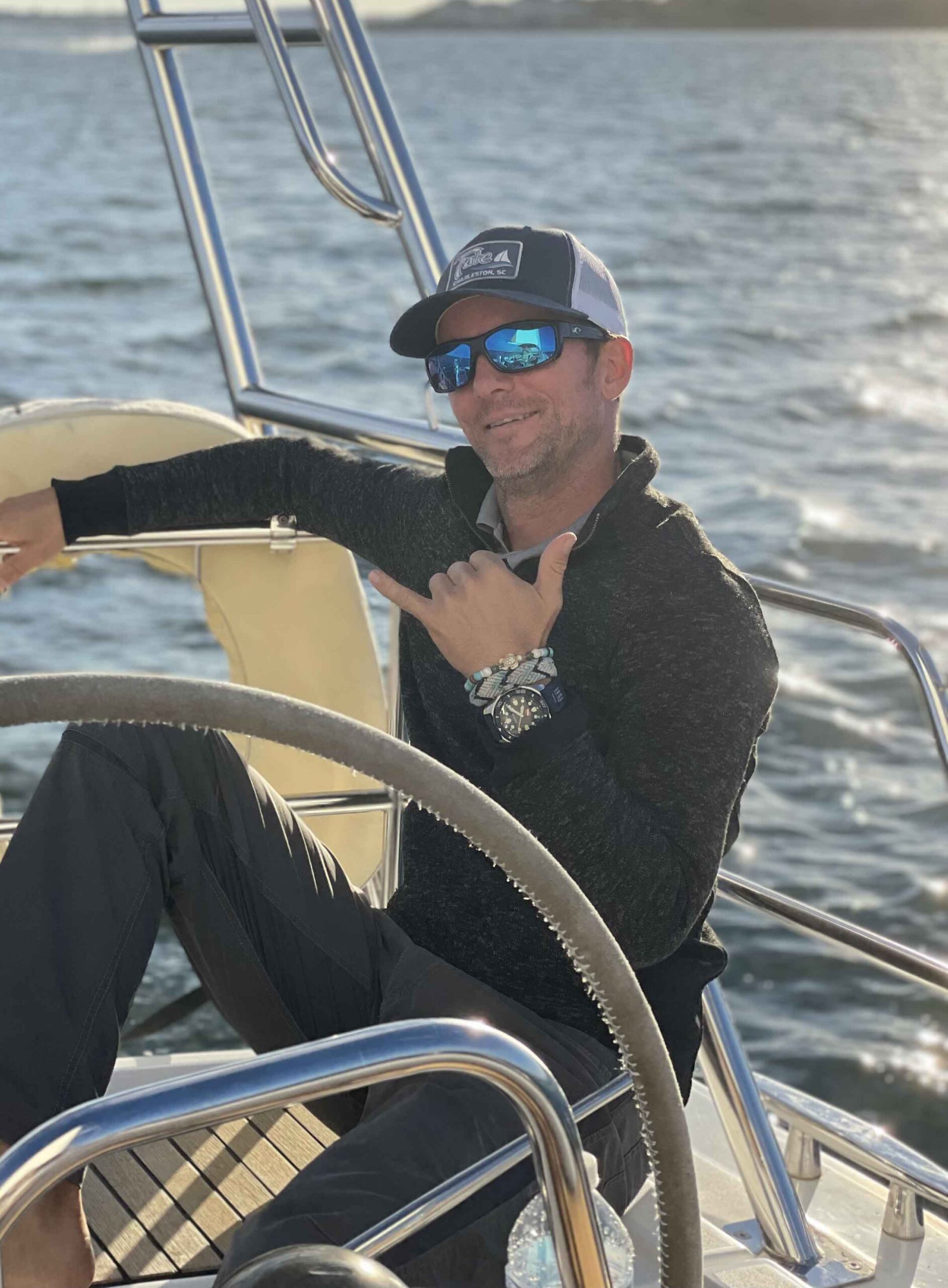a man sitting in a boat on a body of water