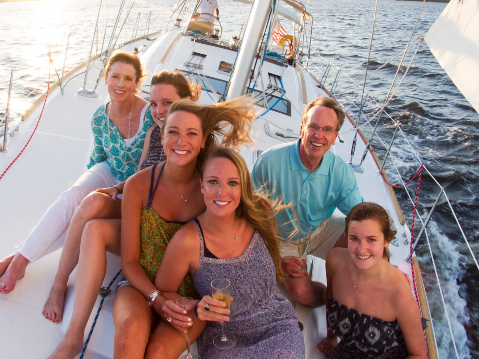 Kirsten Sheridan et al. on a boat posing for the camera