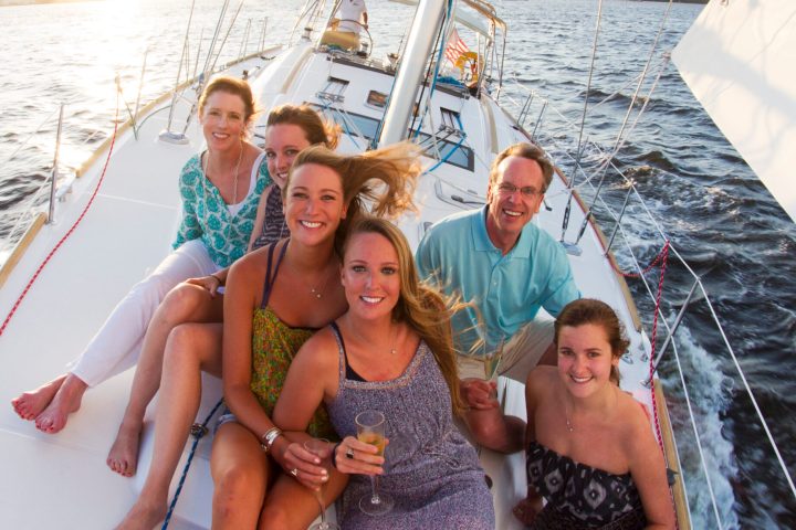 Kirsten Sheridan et al. on a boat posing for the camera
