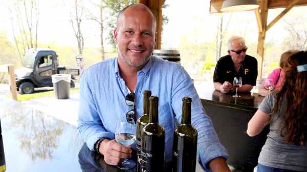 a man holding a glass of wine