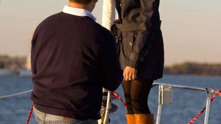 a person standing on a boat in the water