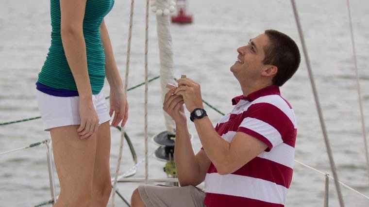 a little boy that is standing in the water