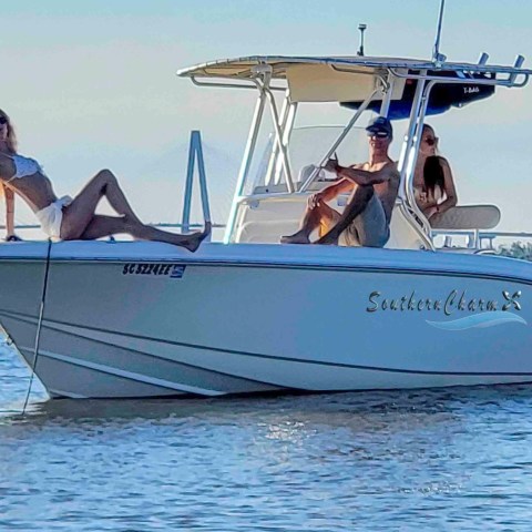 a group of people on a boat in a body of water