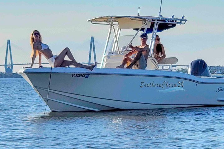 a group of people on a boat in a body of water