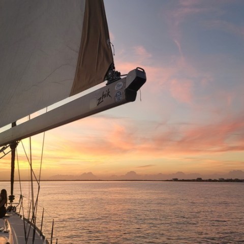a close up of a boat next to a body of water