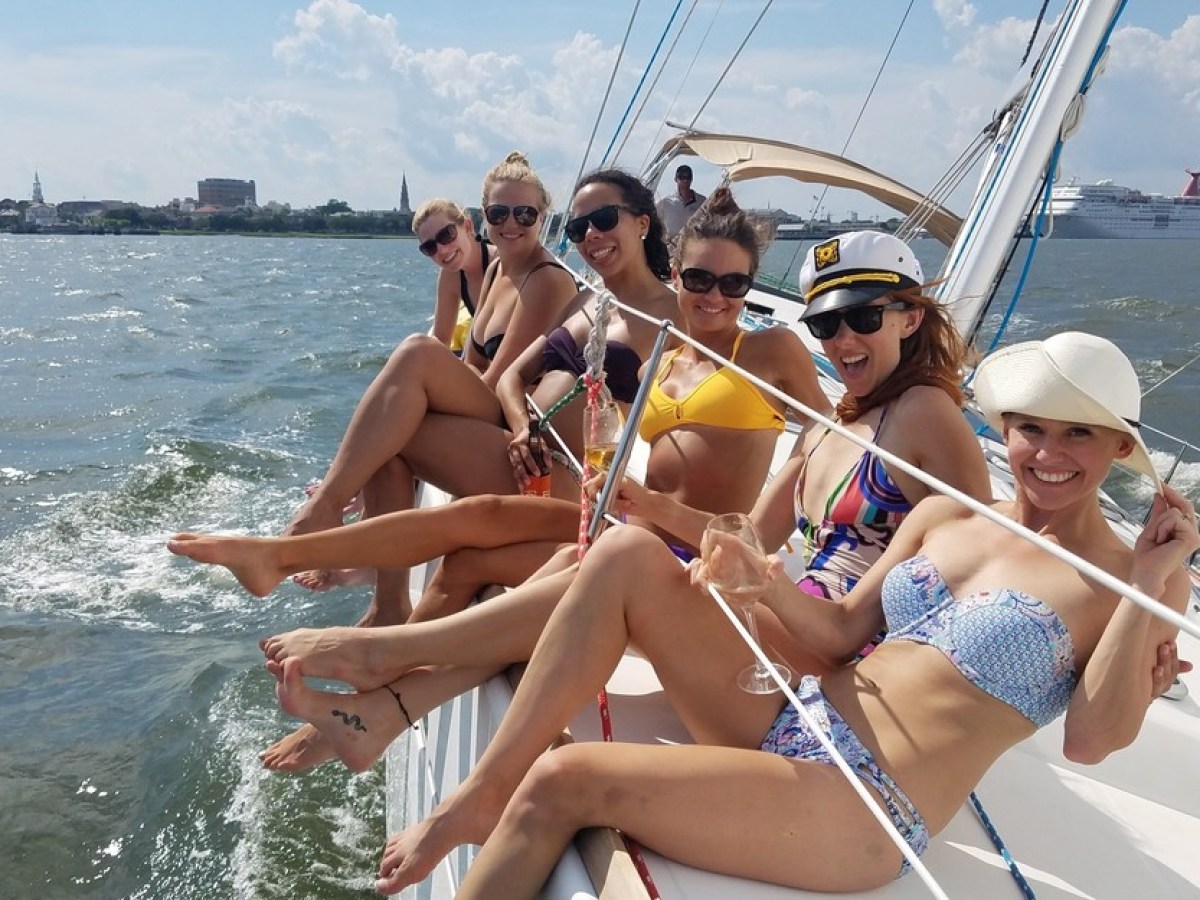 a woman sitting on a boat in a body of water