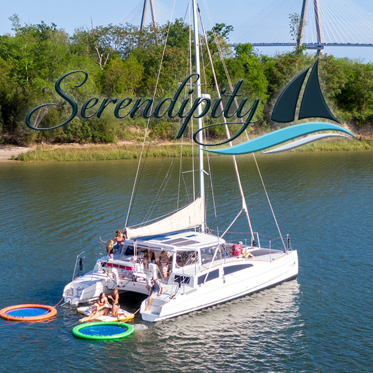 Catamaran on river with people on deck, trees in background, text overlay 'Serendipity' with a boat logo.